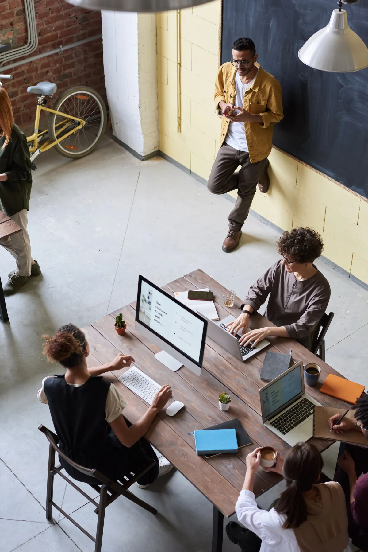 Overhead view of a team working at a shared table