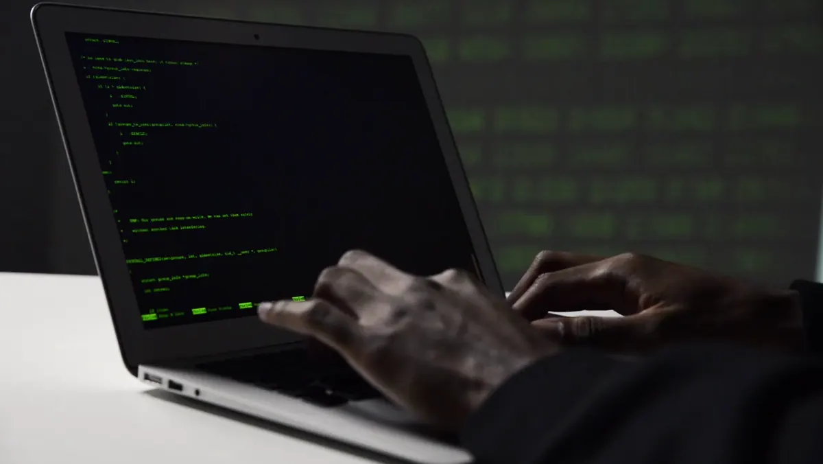 Green terminal code on a laptop