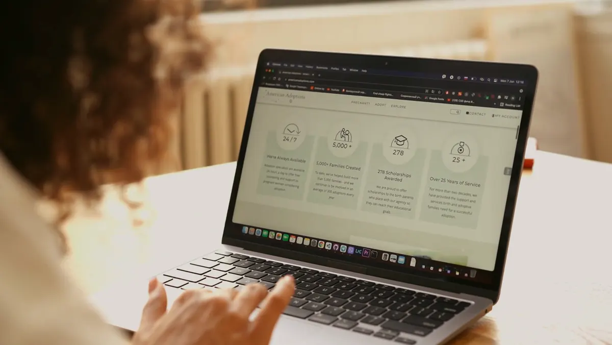 Person browsing a website on a laptop
